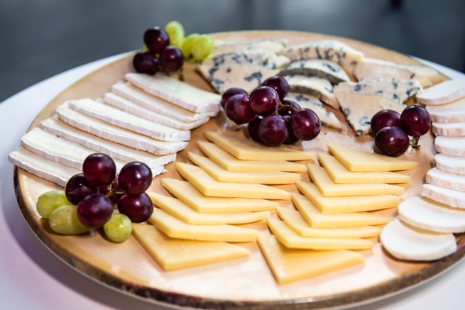 An image of a cheese and grape plate